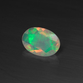 0.44캐럿 천연 멀티컬러 오팔, 타원형 컷, 7.1×5 mm, 투명한