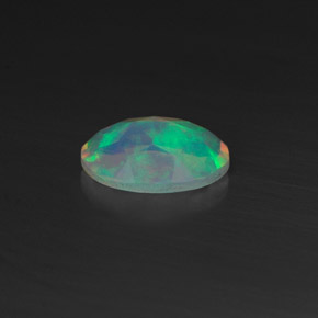 0.44캐럿 천연 멀티컬러 오팔, 타원형 컷, 7.1×5 mm, 투명한