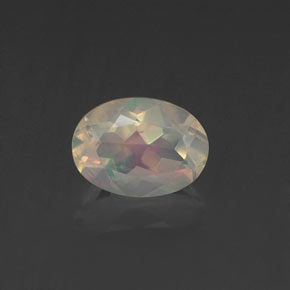 0.62캐럿 천연 멀티컬러 오팔, 타원형 컷, 6.9×5.1 mm, 투명한
