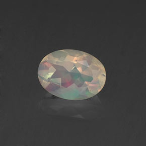 0.62캐럿 천연 멀티컬러 오팔, 타원형 컷, 6.9×5.1 mm, 투명한