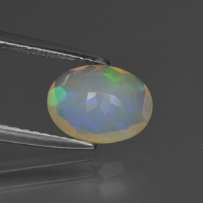 1.02캐럿 천연 멀티컬러 오팔, 타원형 컷, 9.1×7 mm, 투명한