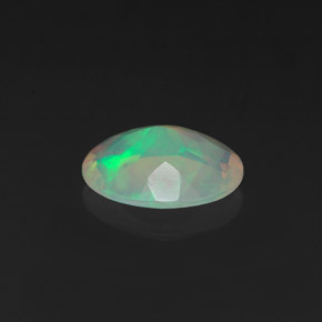 0.75캐럿 천연 멀티컬러 오팔, 타원형 컷, 8.7×6.9 mm, 투명한