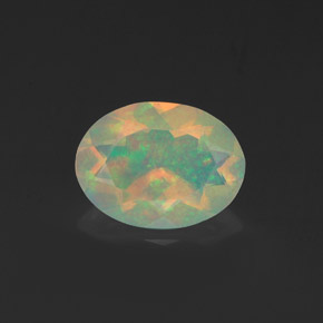 0.91캐럿 천연 멀티컬러 오팔, 타원형 컷, 9.1×6.8 mm, 투명한