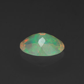 0.91캐럿 천연 멀티컬러 오팔, 타원형 컷, 9.1×6.8 mm, 투명한