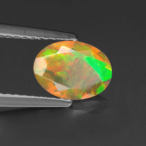 0.69캐럿 천연 멀티컬러 오팔, 타원형 컷, 8.1×6 mm, 투명한