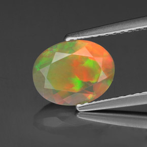 1.11캐럿 천연 멀티컬러 오팔, 타원형 컷, 9×7.1 mm, 투명한