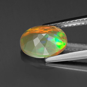 1.11캐럿 천연 멀티컬러 오팔, 타원형 컷, 9×7.1 mm, 투명한