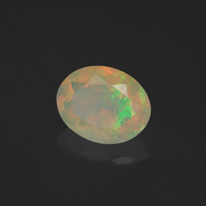 1.23캐럿 천연 멀티컬러 오팔, 타원형 컷, 9×7.2 mm, 투명한