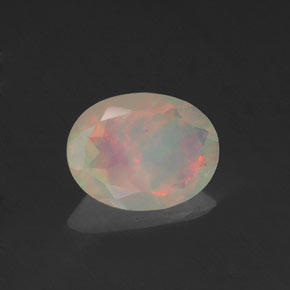 0.64캐럿 천연 멀티컬러 오팔, 타원형 컷, 8×6.1 mm, 투명한