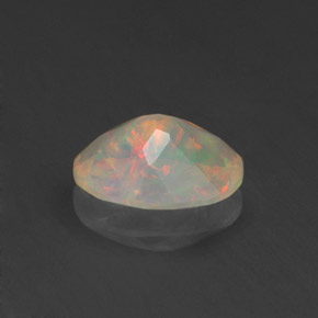 0.71캐럿 천연 멀티컬러 오팔, 타원형 컷, 8.1×6.1 mm, 투명한