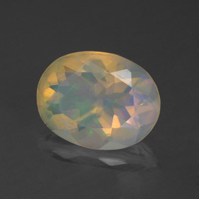 1.12캐럿 천연 멀티컬러 오팔, 타원형 컷, 9.3×7.2 mm, 투명한