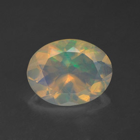 1.24캐럿 천연 멀티컬러 오팔, 타원형 컷, 9.8×7.7 mm, 투명한