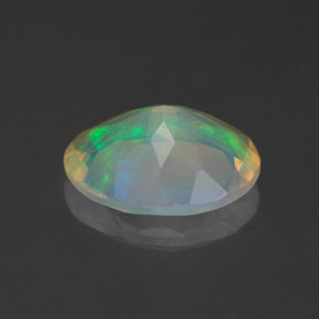 1.24캐럿 천연 멀티컬러 오팔, 타원형 컷, 9.8×7.7 mm, 투명한
