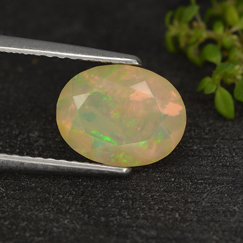 1.14캐럿 천연 멀티컬러 오팔, 타원형 컷, 9.4×7.3 mm, 투명한