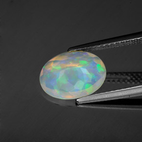 1.22캐럿 천연 멀티컬러 오팔, 타원형 컷, 10.7×8 mm, 투명한