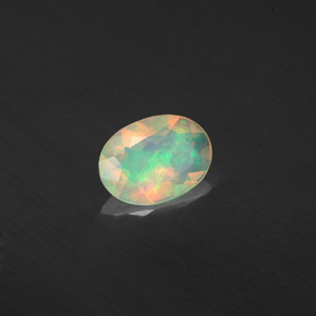 0.37캐럿 천연 멀티컬러 오팔, 투명한, 7×5.1 mm, 투명/반투명