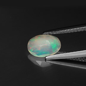 0.58캐럿 천연 멀티컬러 오팔, 투명한, 8.6×6.4 mm, 투명/반투명
