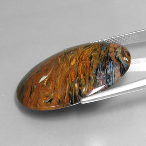 25.47캐럿 천연 멀티컬러 피터사이트, 타원형 컷, 30.2×22.4 mm, 불투명체