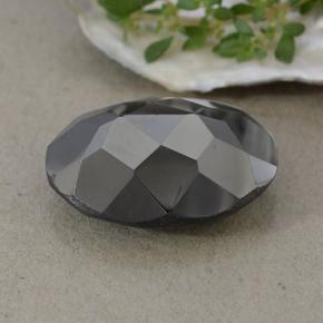 27.02캐럿 천연 블랙 앤 그레이 메탈릭 파이라이트, 타원형 컷, 19.7×14.9 mm, 불투명체