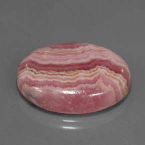 24.57캐럿 천연 멀티컬러 로도크로사이트, 타원형 컷, 23.2×18.1 mm, 불투명체