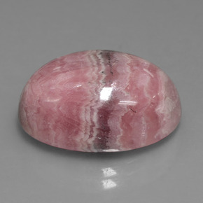 25.74캐럿 천연 멀티컬러 로도크로사이트, 타원형 컷, 20.2×15.2 mm, 불투명체