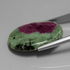 28.10캐럿 천연 멀티컬러 루비 조이사이트, 타원형 컷, 25.9×19.3 mm, 불투명체