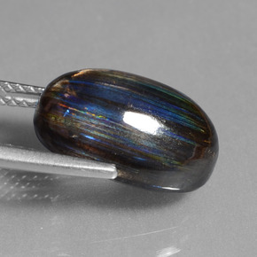 6.73캐럿 천연 레인보우 컬러 스카폴라이트, 타원형 컷, 13.6×9.2 mm, 투명한