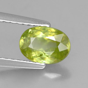0.88캐럿 천연 골든 그린 스펜(티타나이트), 타원형 컷, 7.1×5 mm, VS