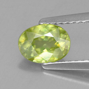 0.81캐럿 천연 골든 그린 스펜(티타나이트), 타원형 컷, 6.7×5 mm, VS