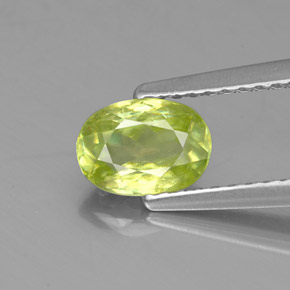 0.84캐럿 천연 골든 그린 스펜(티타나이트), 타원형 컷, 6.8×4.8 mm, VS