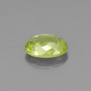 0.84캐럿 천연 골든 그린 스펜(티타나이트), 타원형 컷, 6.8×4.8 mm, VS
