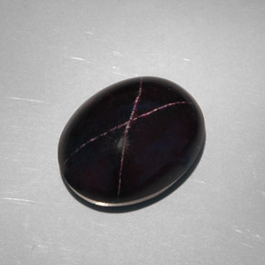 28.81캐럿 천연 붉은빛 블랙 스타 가넷, 타원형 컷, 18.8×14.6 mm, 불투명체