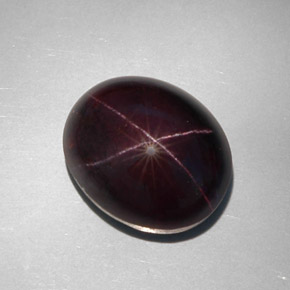 34.12캐럿 천연 붉은빛 블랙 스타 가넷, 타원형 컷, 18.1×15 mm, 불투명체