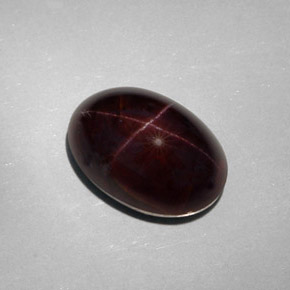 25.18캐럿 천연 붉은빛 블랙 스타 가넷, 타원형 컷, 17.5×12.1 mm, 불투명체