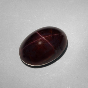 25.18캐럿 천연 붉은빛 블랙 스타 가넷, 타원형 컷, 17.5×12.1 mm, 불투명체