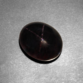 7.21캐럿 천연 붉은빛 블랙 스타 가넷, 타원형 컷, 11.9×9.7 mm, 불투명체