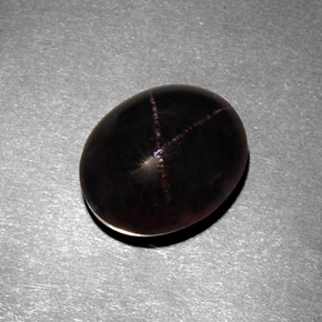 7.21캐럿 천연 붉은빛 블랙 스타 가넷, 타원형 컷, 11.9×9.7 mm, 불투명체