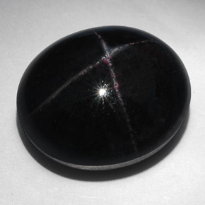 52.94캐럿 천연 붉은빛 블랙 스타 가넷, 타원형 컷, 21.5×18.3 mm, 불투명체