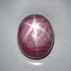 28.59캐럿 천연 보랏빛 레드 스타 루비, 타원형 컷, 16.6×13.7 mm, 불투명체