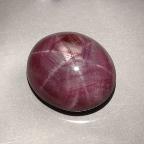 27.30캐럿 천연 보랏빛 레드 스타 루비, 타원형 컷, 18×15.2 mm, 불투명체