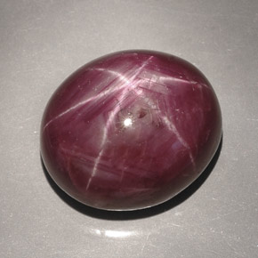 46.74캐럿 천연 보랏빛 레드 스타 루비, 타원형 컷, 19.9×17.1 mm, 불투명체