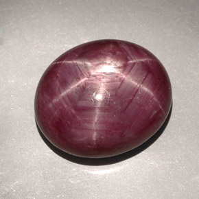 31.39캐럿 천연 보랏빛 레드 스타 루비, 타원형 컷, 19.6×16.6 mm, 불투명체