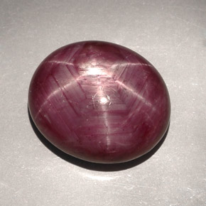 31.39캐럿 천연 보랏빛 레드 스타 루비, 타원형 컷, 19.6×16.6 mm, 불투명체