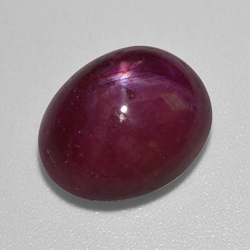 12.01캐럿 천연 다크 레드 스타 루비, 타원형 컷, 13.8×11.2 mm, 불투명체