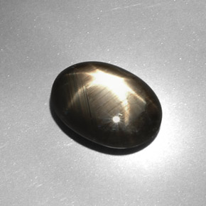 7.08캐럿 천연 검정색 스타 사파이어, 타원형 컷, 13.6×10.1 mm, 불투명체