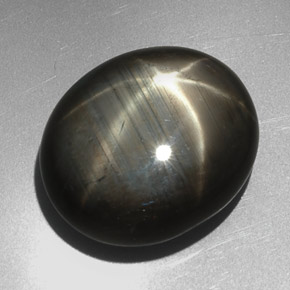 27.29캐럿 천연 Silver Black 스타 사파이어, 타원형 컷, 19.4×16.5 mm, 불투명체