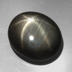 27.29캐럿 천연 Silver Black 스타 사파이어, 타원형 컷, 19.4×16.5 mm, 불투명체