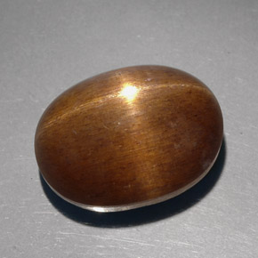 23.68캐럿 천연 골든 브라운 스타 선스톤, 타원형 컷, 18.8×14.3 mm, 불투명체