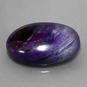 27.34캐럿 천연 멀티컬러 수길라이트, 타원형 컷, 25.3×18.3 mm, 불투명체