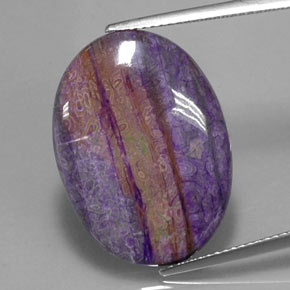 12.41캐럿 천연 멀티컬러 수길라이트, 타원형 컷, 23.9×17.4 mm, 불투명체